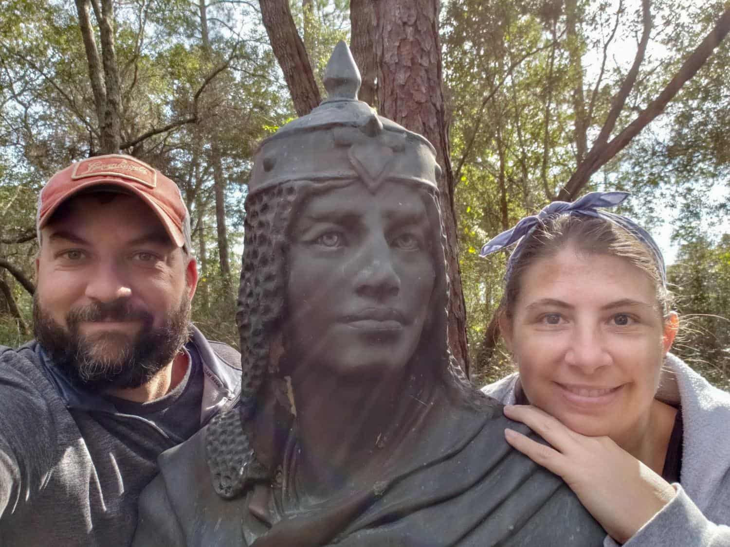 john and jenny with statue in foley, alabama