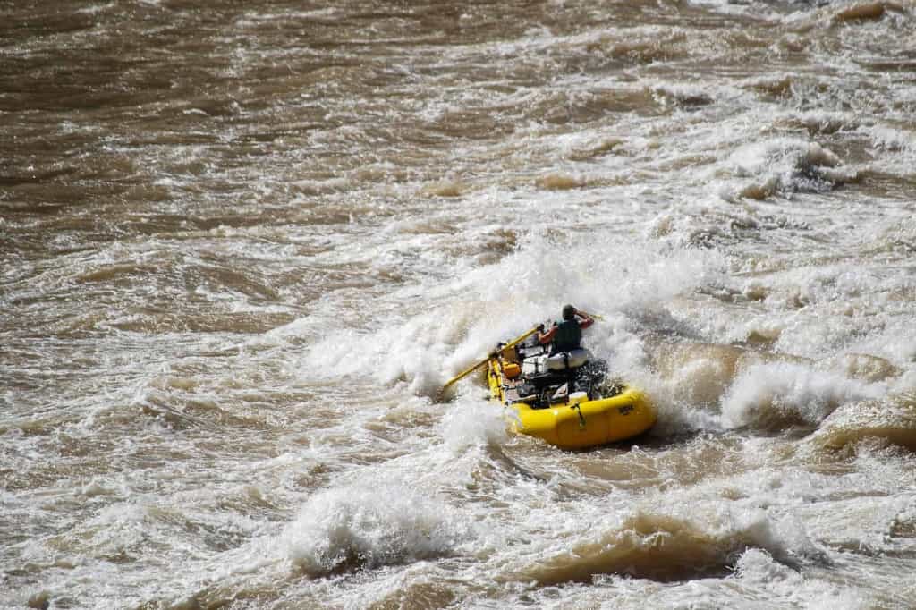 a white water rafter in the rapids of the colorado river in the grand canyon