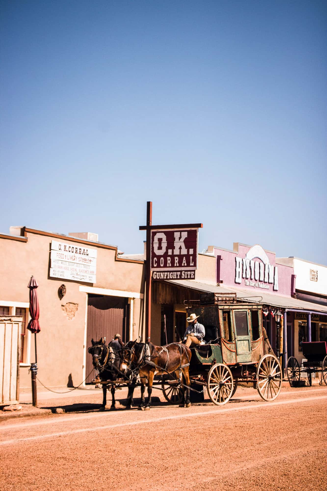 a stagecoach sits outside the OK corral on East Allen St in Tombstone, is tombstone worth visiting, yes, because it is an experience of stepping back in time and getting to ride in a stagecoach like this one