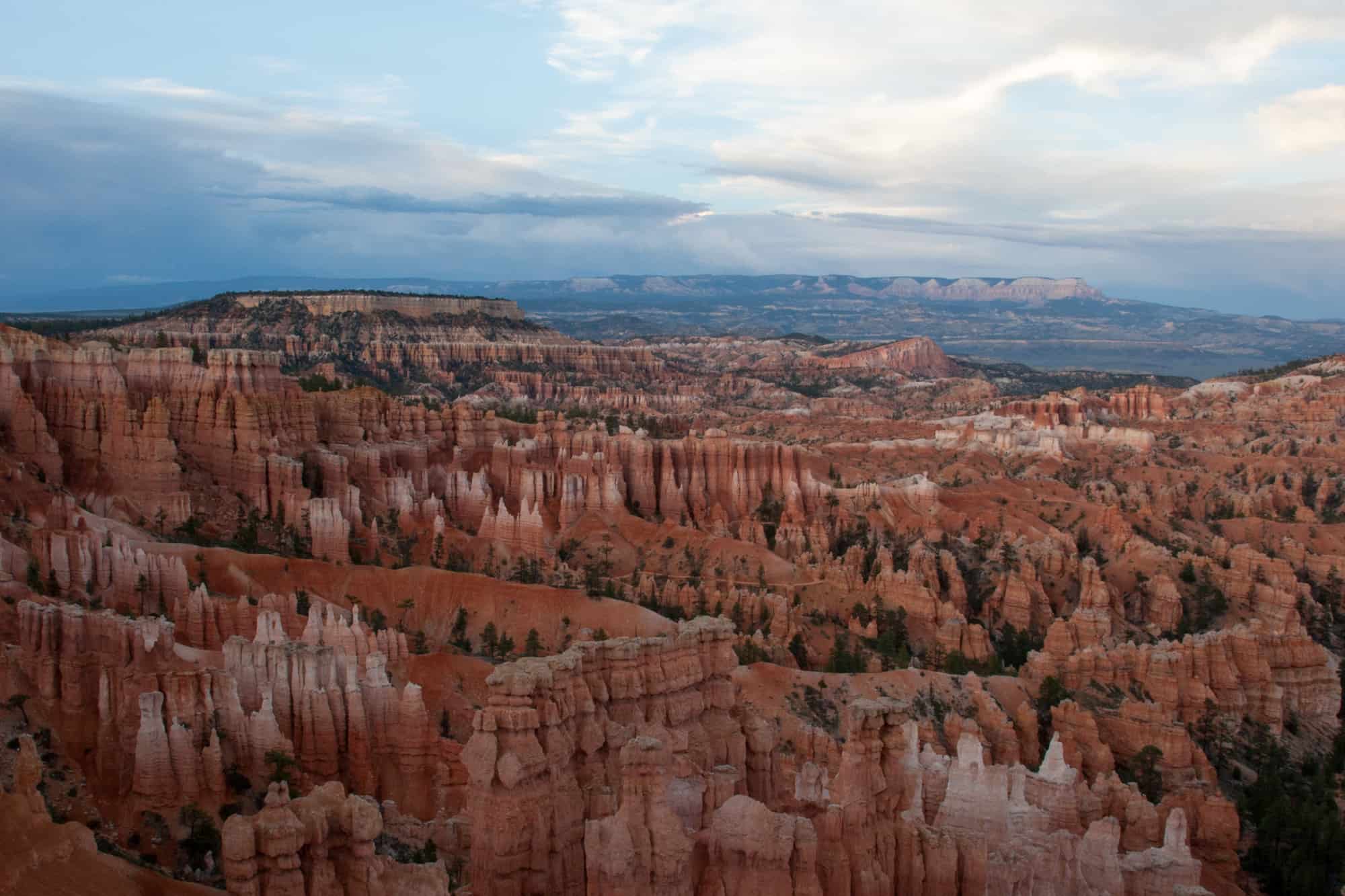 bryce canyon hoodoos at a cloud-covered sunset