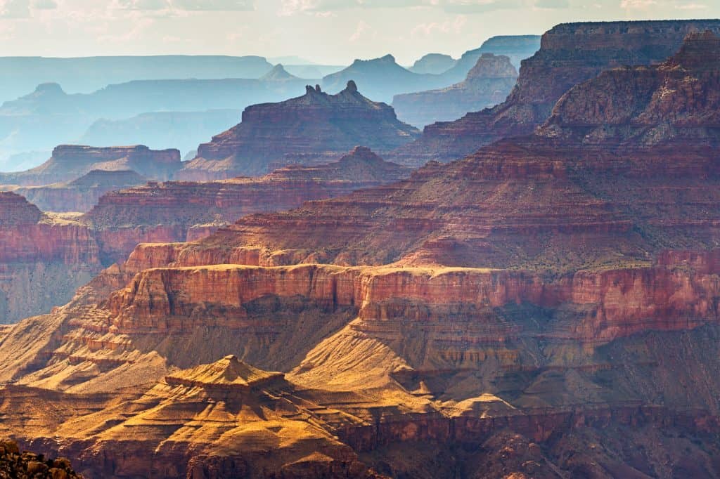 a close up of the grand canyon showing different heights and colors