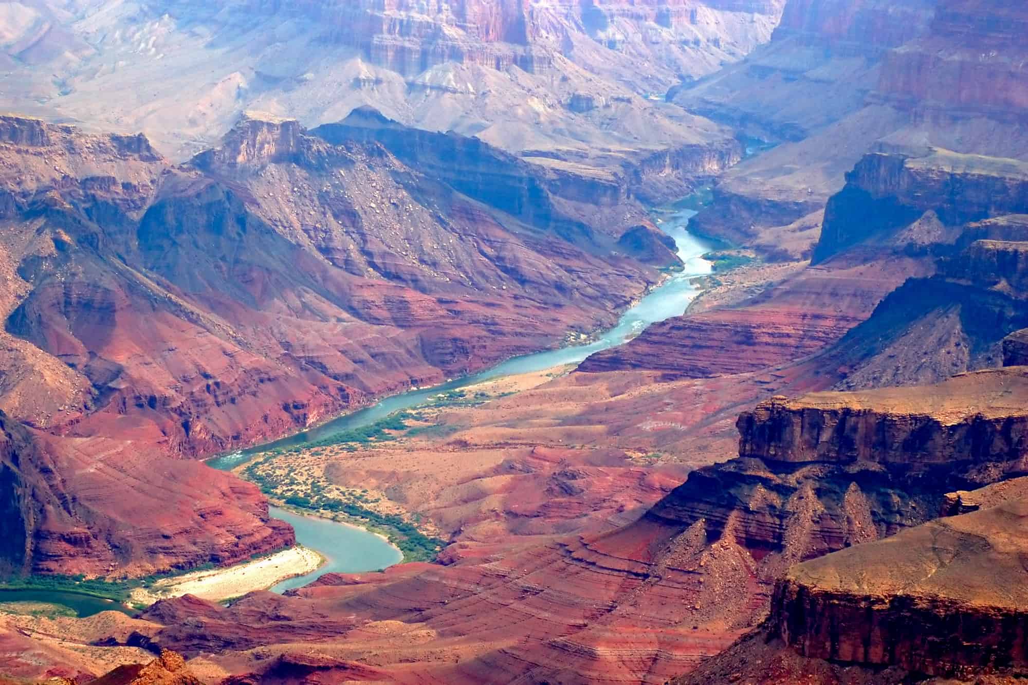 the colorado river as it runs though the base of the grand canyon