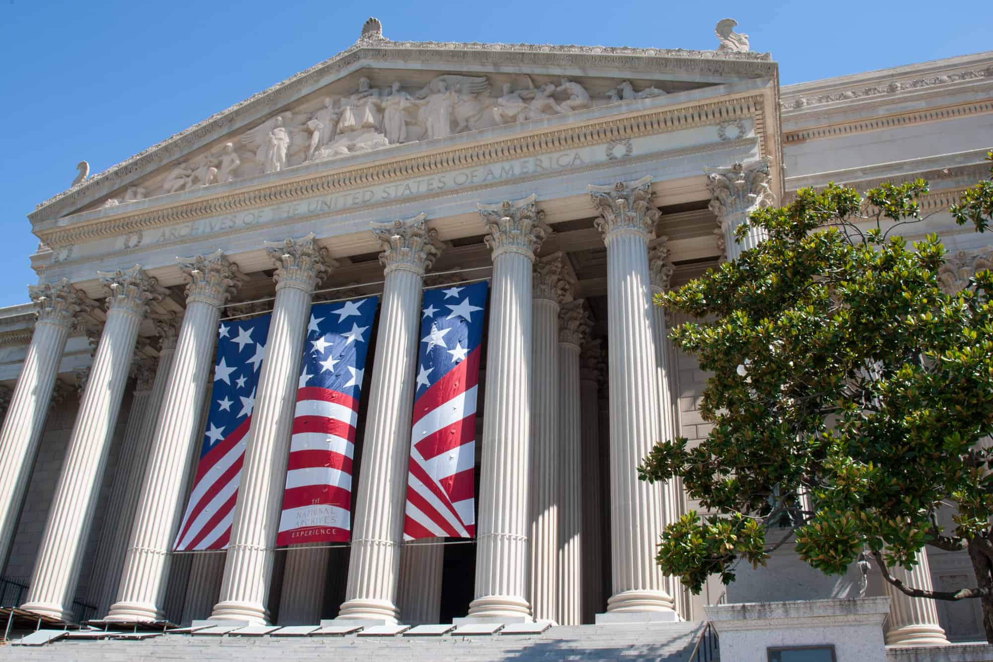 archives of the USA located in washington dc with long banners out front that represent the american flag, is seattle in washington dc is a common misconception but washington dc is the political center of the US while Seattle is a more vibrant, carefree city