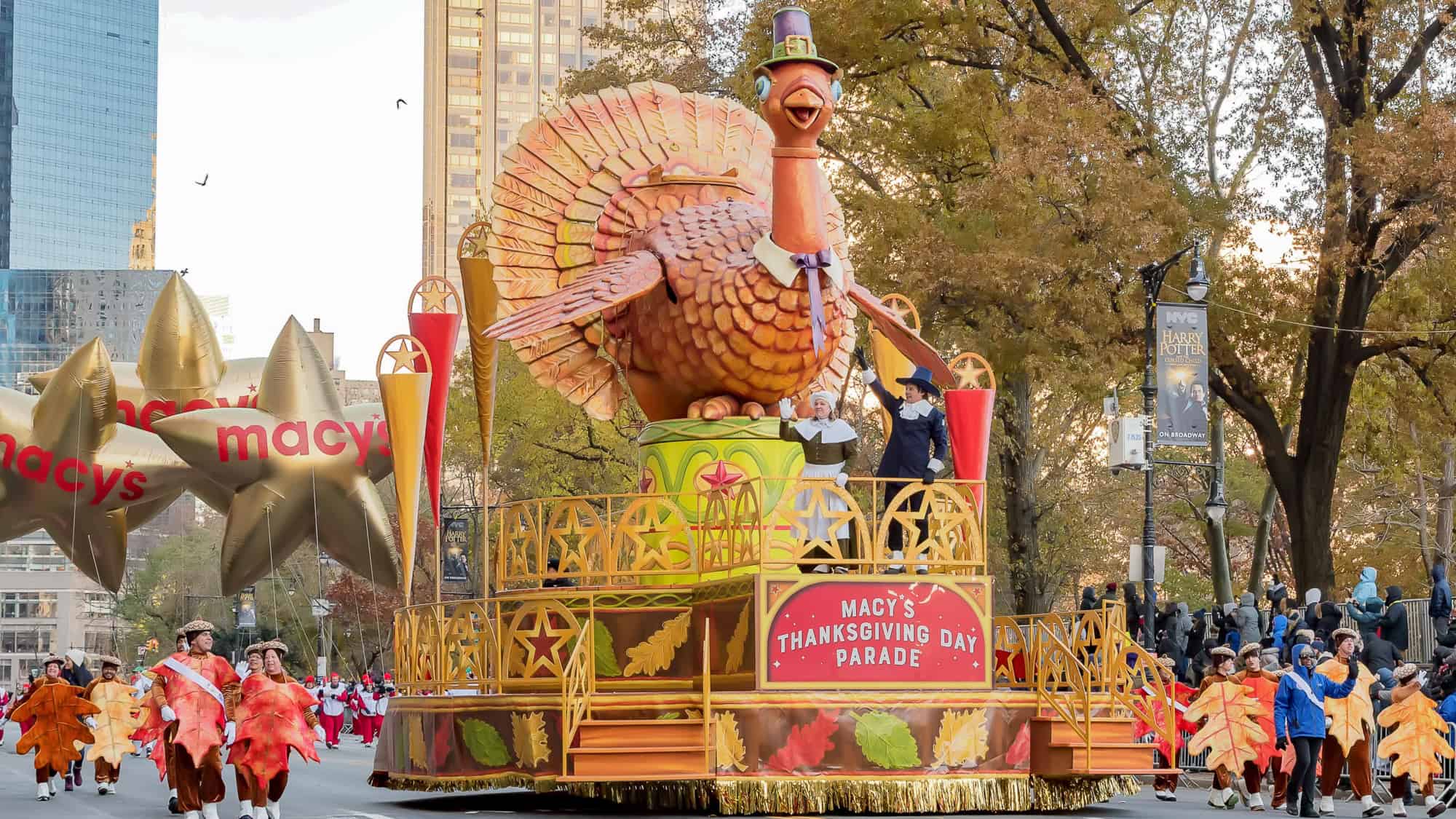 A giant turkey float with Pilgrim figures passes through the street during the Macy’s Thanksgiving Day Parade.