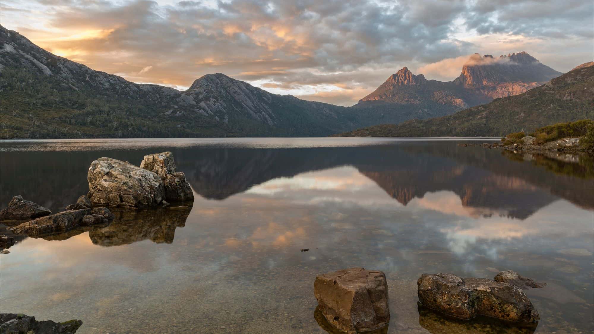 a beautiful lake scene with mountain relection at cradle mountain in tasmania, australia.