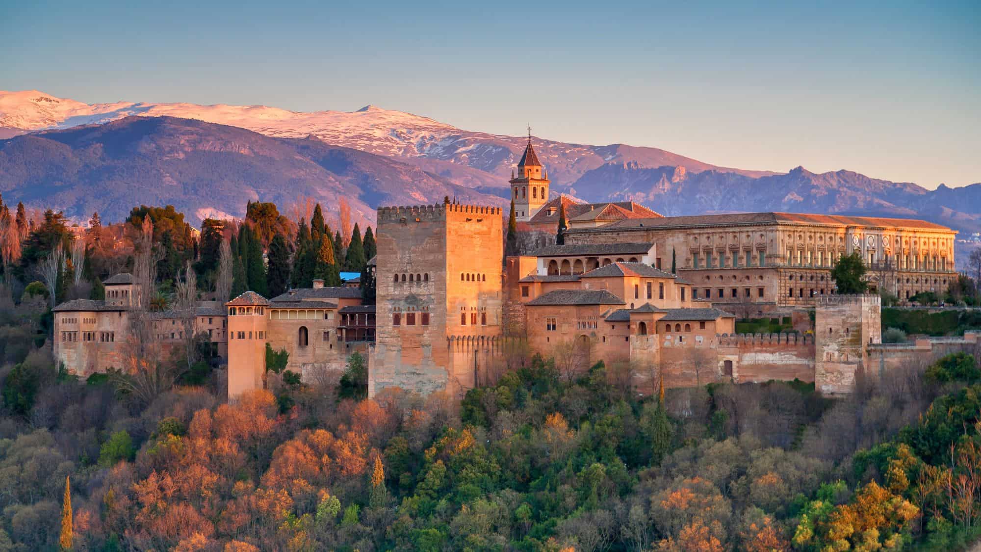 Ancient Alhambra palace in Granada old town, Spain travel photo. Wide panorama of alhambra castle