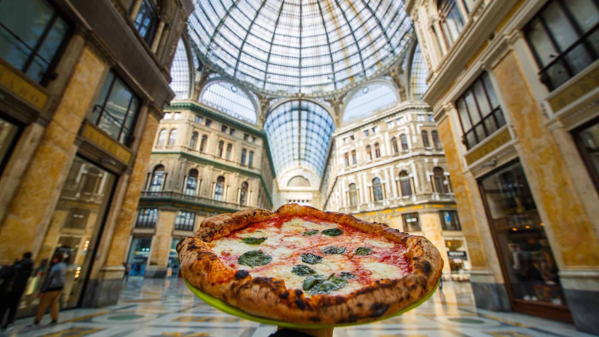 Pizza Margherita Napoletana with tomato, basil and buffalo mozzarella photographed under the Galleria Umberto in Naples