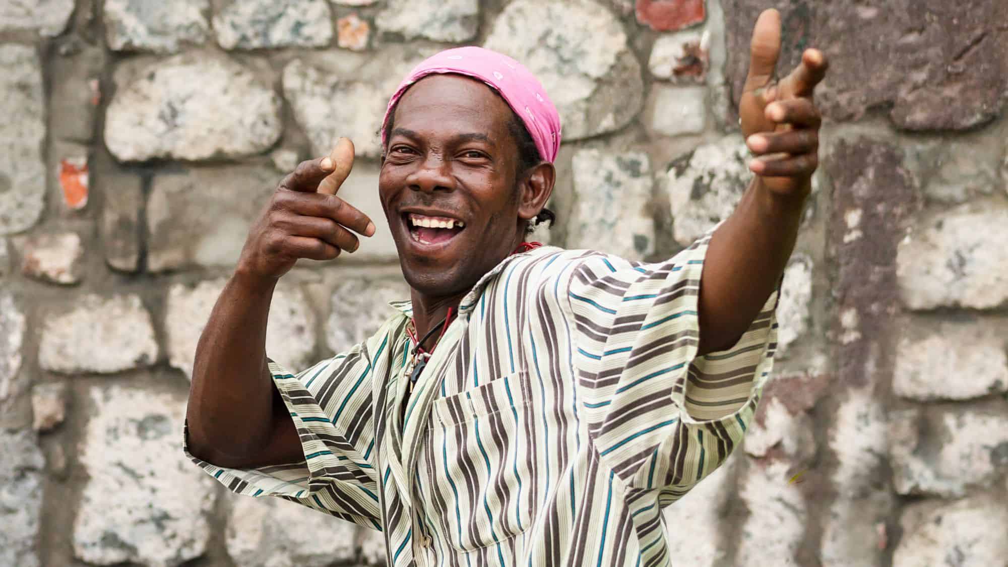ROSEAU,DOMINICA-AUGUST 8 , 2011 : Dominica native black man is greeting and smiling. Caribbean islanders people are know for they cordiality.