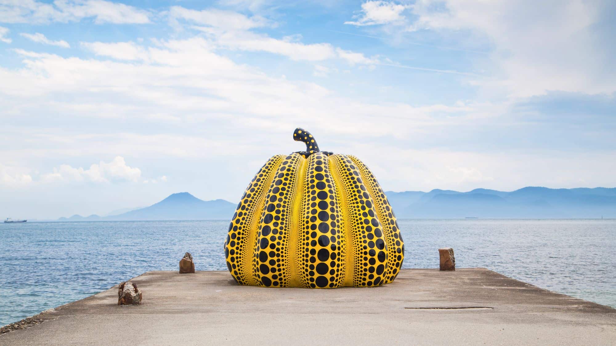 Naoshima, Japan - August 13 2018: Yayoi Kusama's famous pumpkin artwork on Naoshima Island