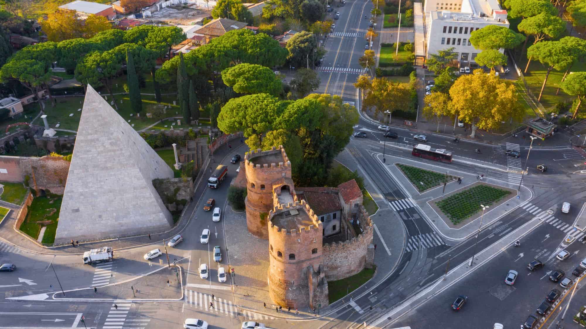 Rome, Italy - 11 21 2022: Aerial view of Ostiense square and Pyramid of Cestius, a Roman Era pyramid.
