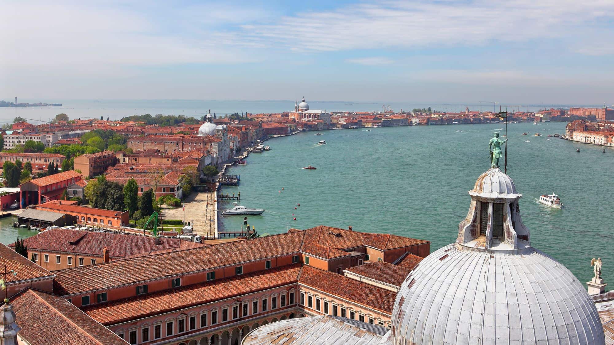 Venice, Italy - April 30 2019: View of the Giudecca Canal from the bell tower of San Giorgio Maggiore church. The canal separates Giudecca Island from the Dorsoduro district.
